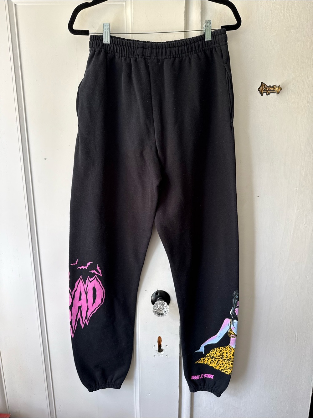 Black Graphic Ankle Sweatpants with Pink Accents by